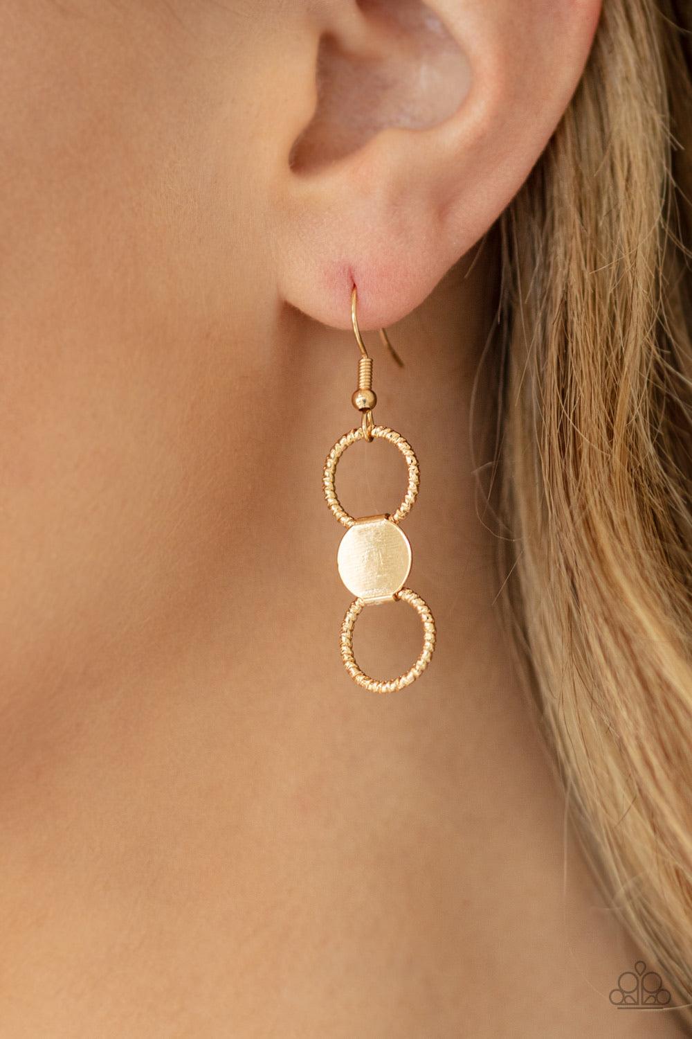 Paparazzi Accessories Net Result - Gold An interlocking net of textured gold rings and reflective gold discs link into a dramatically netted fringe below the collar. Features an adjustable clasp closure. Jewelry
