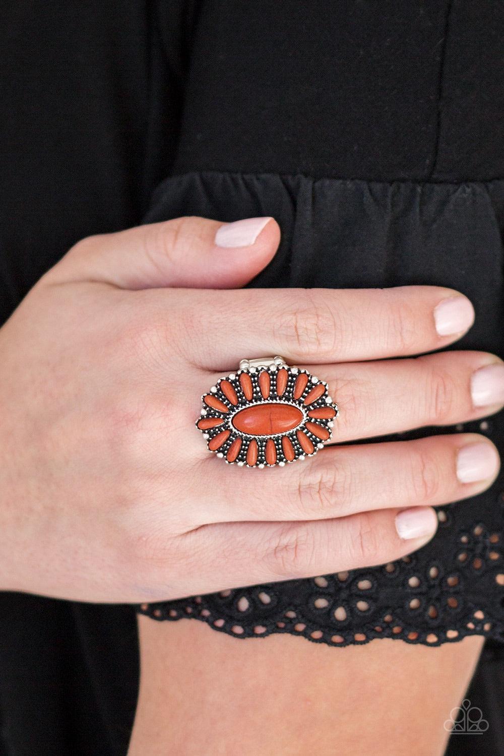 Paparazzi Accessories Cactus Cabana - Orange Vivacious orange stones are pressed into a studded silver frame, coalescing into a whimsical floral centerpiece atop the finger. Features a stretchy band for a flexible fit. Jewelry