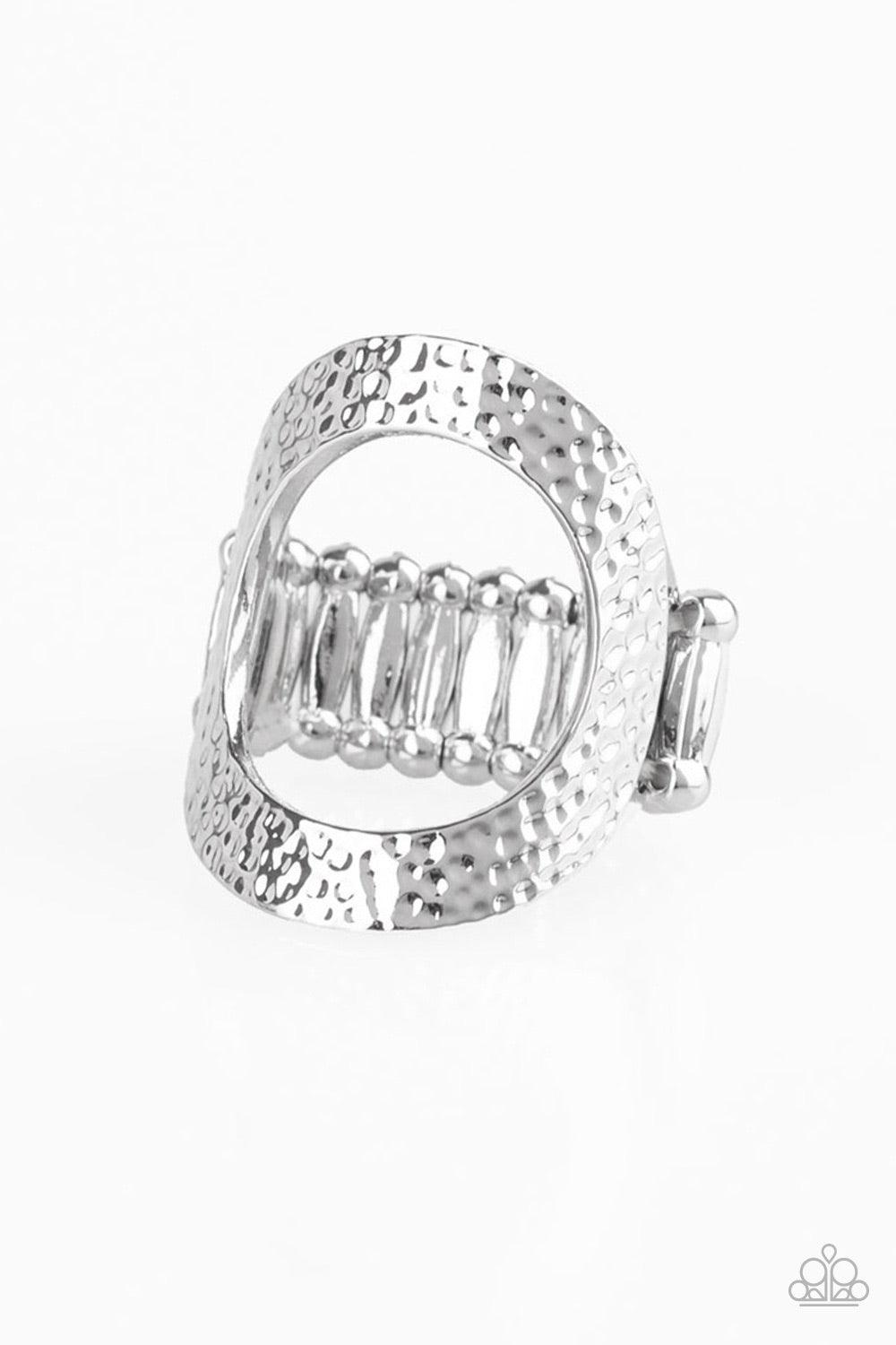 Paparazzi Accessories Tour De Contour - Silver Delicately hammered in shimmery textures, a glistening silver frame circles atop the finger for a modern look. Features a stretchy band for a flexible fit. Jewelry