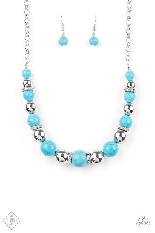 Paparazzi Accessories The Ruling Class - Blue A strand of faux turquoise stones, shiny silver beads, and white rhinestone-encrusted rings falls below the collar in a refined fashion. Features an adjustable clasp closure. Jewelry