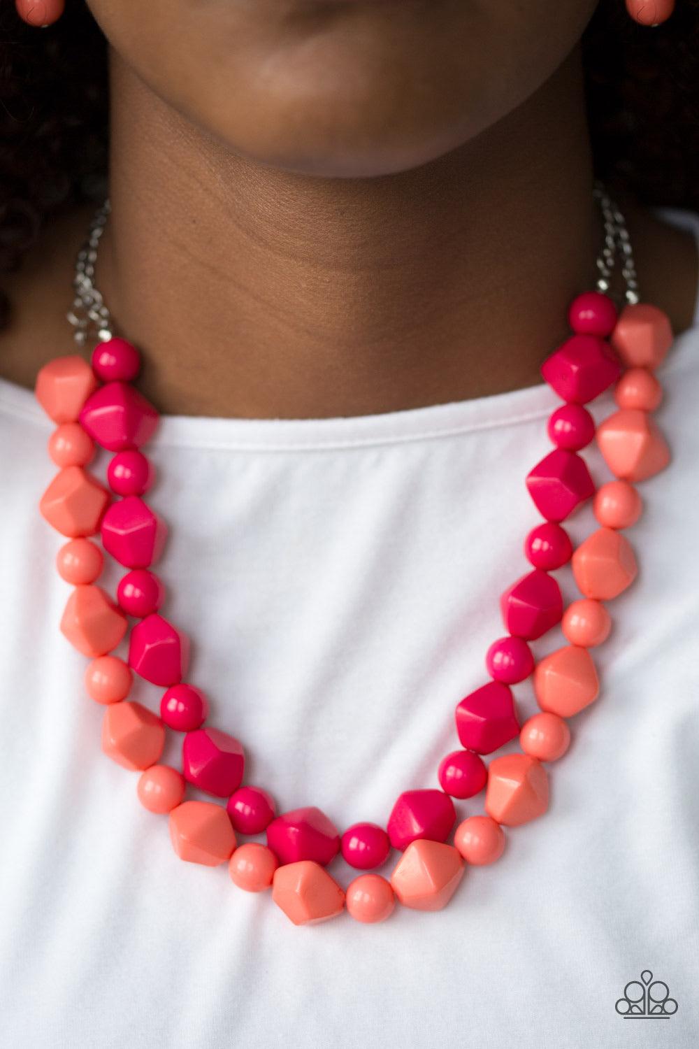 Paparazzi Accessories Rio Rhythm - Multi Tiers of round and abstract pink and coral beading layer below the collar in a colorful tribal fashion. Features an adjustable clasp closure. Sold as one individual necklace. Includes one pair of matching earrings.