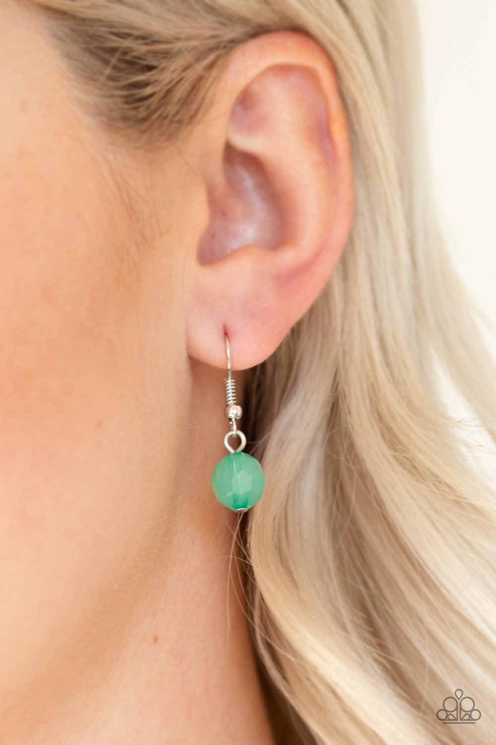 Paparazzi Accessories Native New Yorker - Green A collection of ornate silver accents and glassy and opaque green crystal-like beads give way to shimmery silver layers for a refined look. Features an adjustable clasp closure. Jewelry