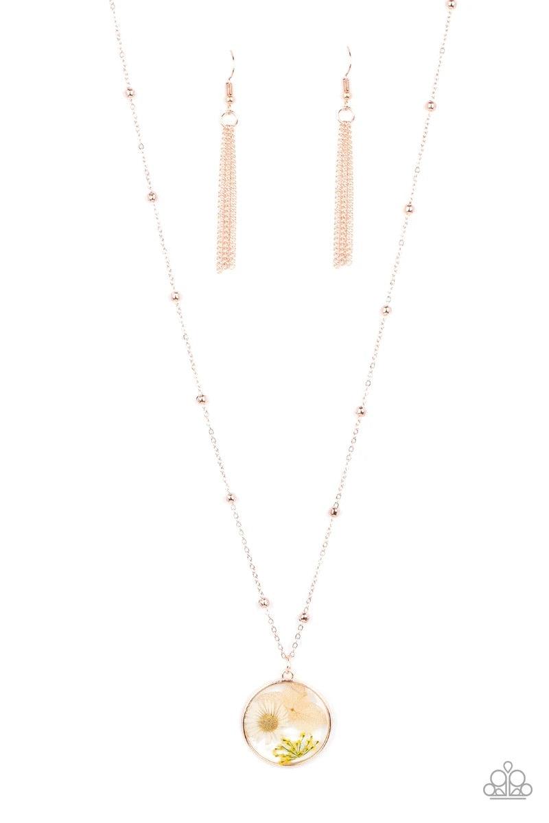 Paparazzi Accessories Floral Embrace - Rose Gold A delightful bouquet of pressed flowers encased in a rose gold frame gently sway from a delicate rose gold chain accented with rose gold beads. Features an adjustable clasp closure. Sold as one individual n