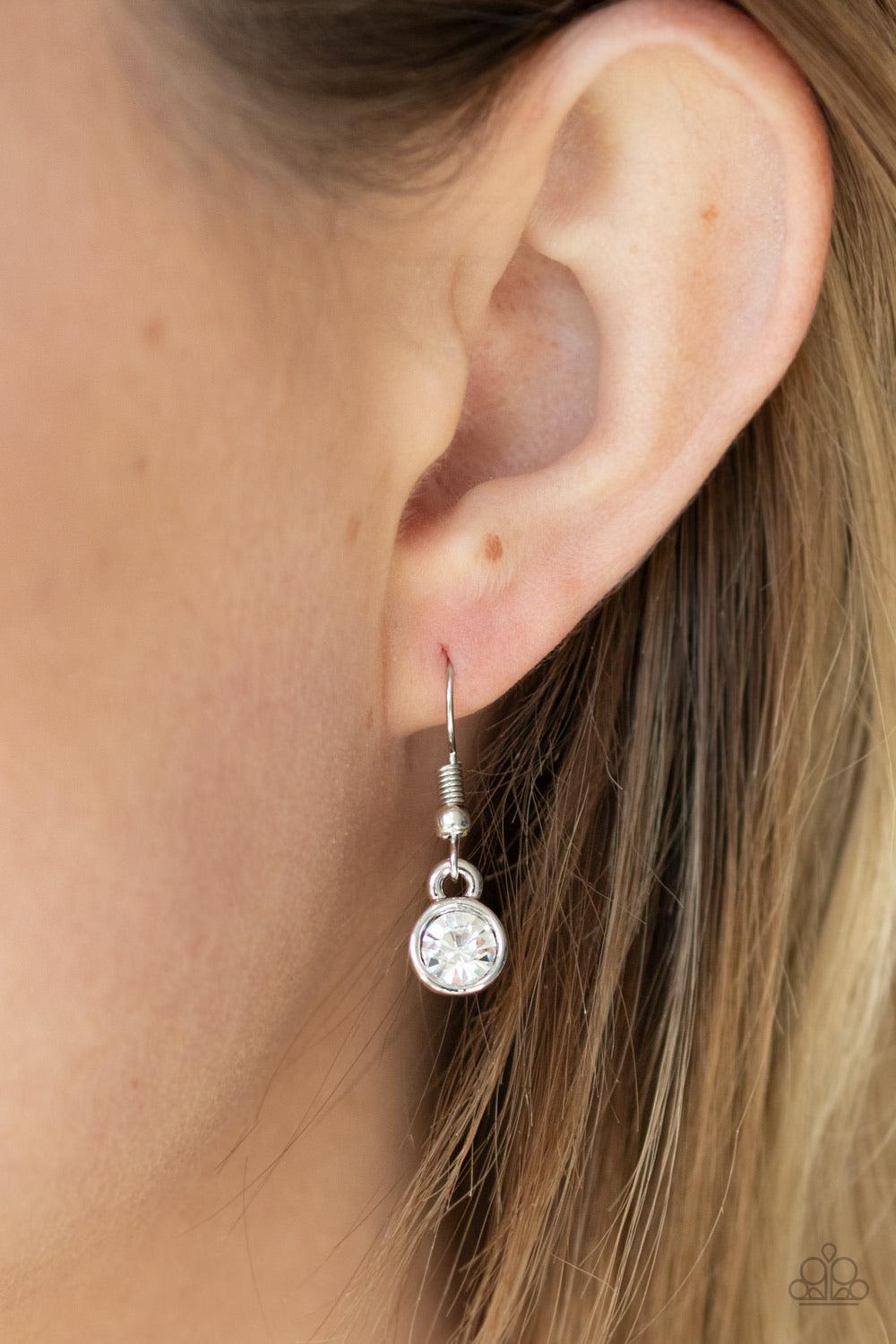 Paparazzi Accessories Bless Your Heart - Red A red rhinestone encrusted heart, shiny silver heart, and glittery white rhinestone encrusted heart swings from the bottom of a red rhinestone dotted fitting, creating a romantically oversized pendant below the