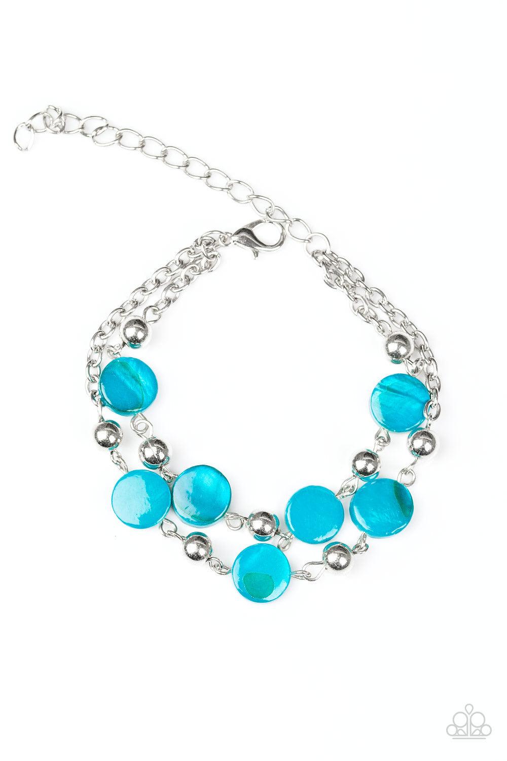 Paparazzi Accessories One Bay At A Time - Blue Brushed in a shell-like shimmer, iridescent blue beads and dainty silver beads link around the wrist for a seasonal look. Features an adjustable clasp closure. Jewelry
