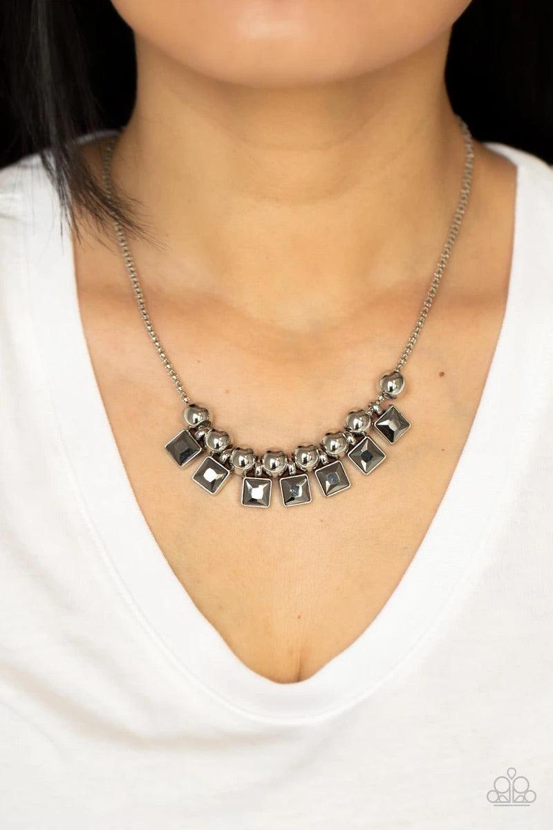 Paparazzi Accessories Graciously Audacious ~Silver Smoky hematite square rhinestone frames and oversized silver beads alternate along a silver popcorn chain, creating a stellar fringe below the collar. Features an adjustable clasp closure. Sold as one ind