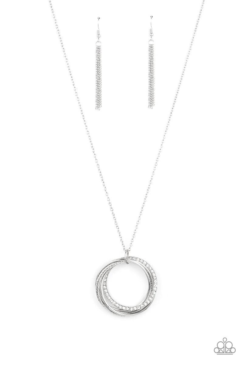 Paparazzi Accessories Harmonic Halos ~White An interconnected collection of shiny silver, textured, and white rhinestone encrusted rings link into a melodic pendant at the bottom of a lengthened silver chain. Features an adjustable clasp closure. Sold as