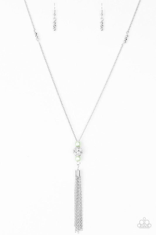 Paparazzi Accessories Century Shine - Green Infused with faceted silver accents, pearly green beads and a silver bead encrusted in glittery white rhinestones slide along a shimmery silver chain, creating an elegant centerpiece. A glistening silver tassel