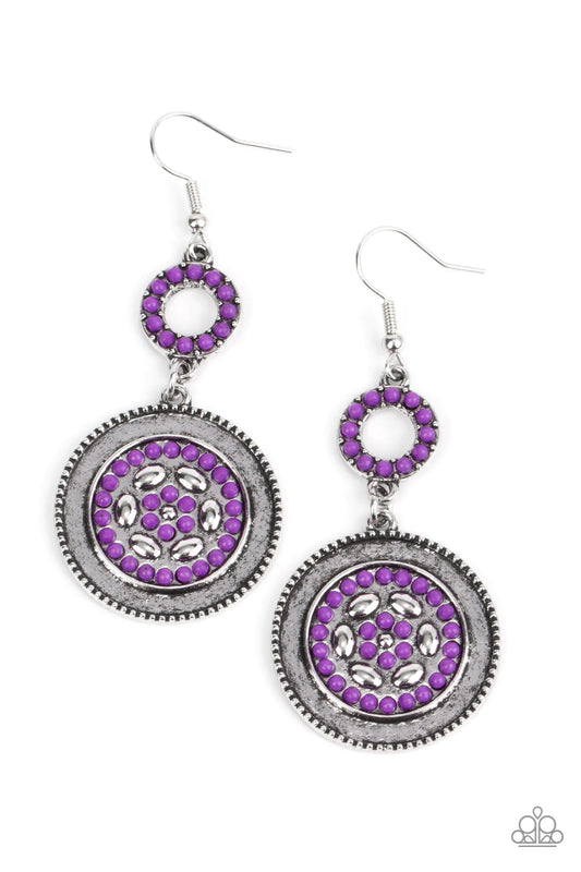 Paparazzi Accessories Meadow Mantra - Purple Dotted in dainty purple seed beads, a dainty silver hoop links to an ornate silver disc for a colorful floral finish. Earring attaches to a standard fishhook fitting. Sold as one pair of earrings. Earrings