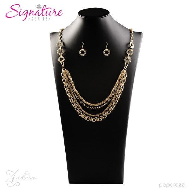Paparazzi Accessories The Melissa Encrusted in glittery white rhinestones, glistening gold frames give way to layers of shimmery gold chains. Varying in size and shimmer, the bold assortment of gold chains drape across the chest in a fierce and flawless f