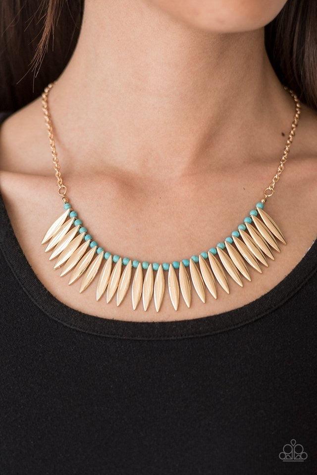 Paparazzi Accessories Tameless Tigress - Gold Shiny gold frames alternate with refreshing turquoise beads along a skinny wire, creating a fierce fringe below the collar. Features an adjustable clasp closure. Jewelry