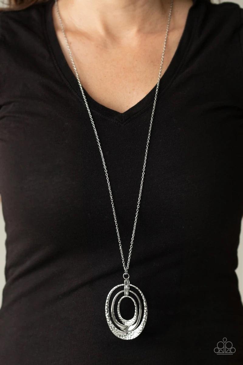 Paparazzi Accessories Dizzying Decor - Silver Flaring out at the bottoms, a trio of smooth and hammered silver frames drip from the bottom of a lengthened silver chain, creating a casually stacked pendant. Features an adjustable clasp closure. Sold as one