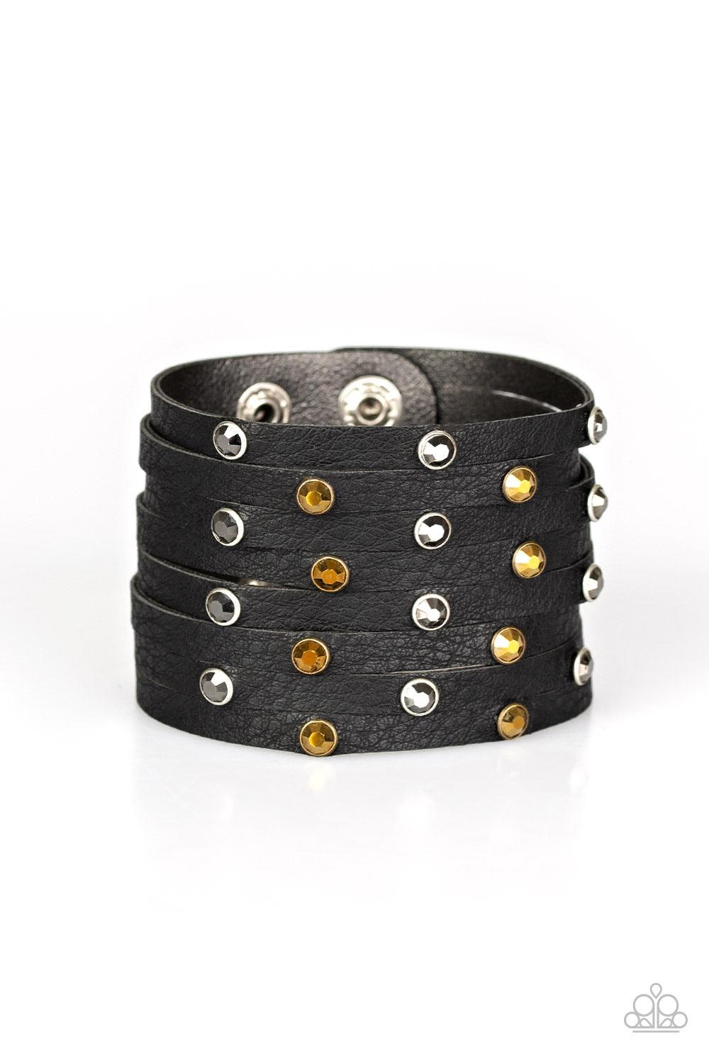 Paparazzi Accessories Go-Getter Glamorous - Black Go Getter Glamorous Black – Paparazzi Bracelet. A thick black leather band has been spliced into eight strips across the wrist. Encased in sleek silver fittings, glittery hematite and aurum rhinestones are