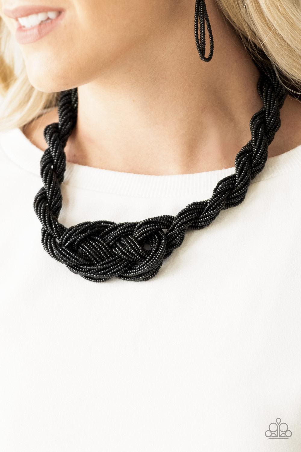 Paparazzi Accessories A Standing Ovation - Black Countless strands of black seed beads are twisted and knotted together to create an unforgettable statement piece. Features an adjustable clasp closure. Sold as one individual necklace. Includes one pair of