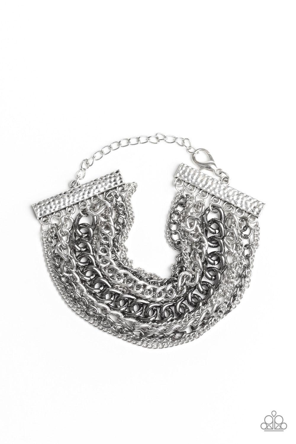 Paparazzi Accessories Metallic Horizon - Multi A gritty mix of mismatched silver and gunmetal chains is strung between two hammered silver fittings, creating edgy layers around the wrist. Features an adjustable clasp closure. Jewelry