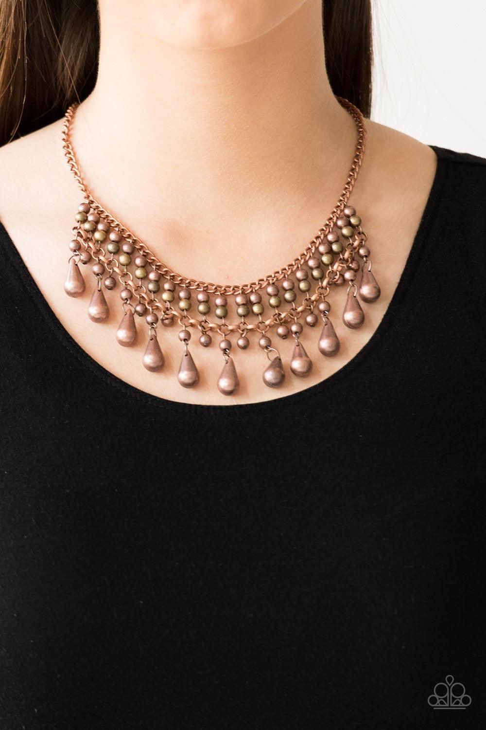Paparazzi Accessories Don’t Forget To BOSS! - Copper Threaded along metallic rods, stacked copper beads give way to shimmery copper teardrops. The edgy fringe flawlessly drapes beneath the collar, creating a sassy tapered fringe. Features an adjustable cl