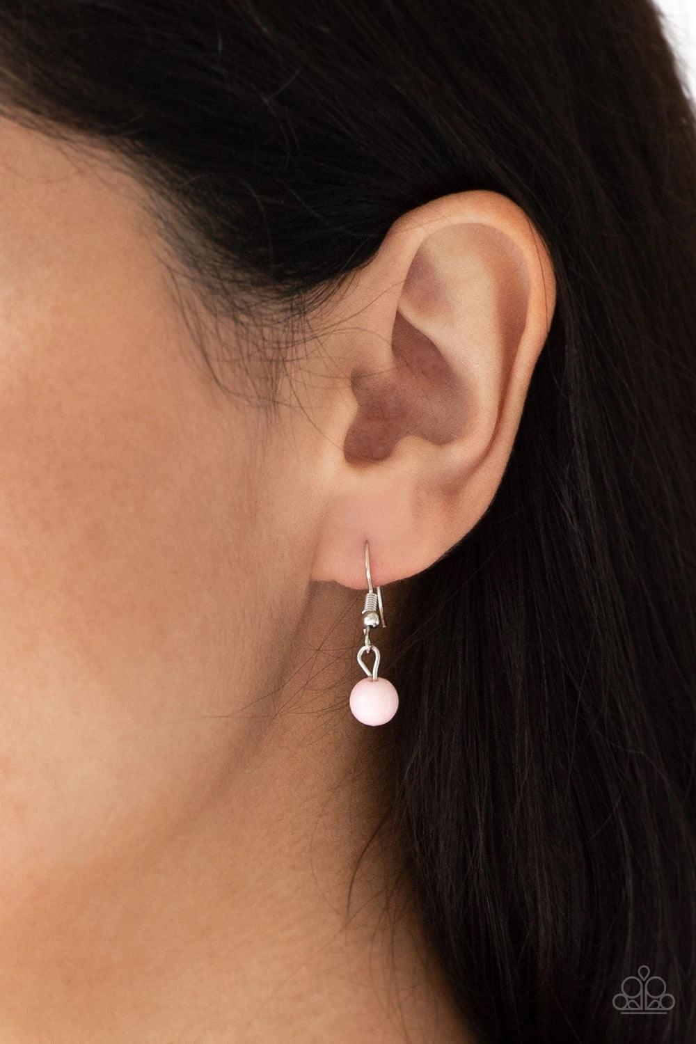 Paparazzi Accessories Flirty Foxtrot - Pink Smooth and hammered silver rings join clusters of shiny pink beads along a shimmery silver chain for a colorful look. Features an adjustable clasp closure. Sold as one individual necklace. Includes one pair of m