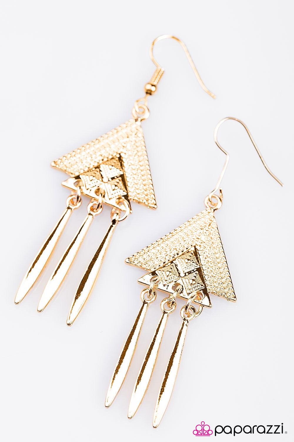 Paparazzi Accessories Desert Star - Gold Stacked golden triangles fall from the ear in a tribal inspired fashion. Featuring a high-sheen matte, flared bars swing from the bottom of the design for a whimsical finish. Earring attaches to a standard fishhook