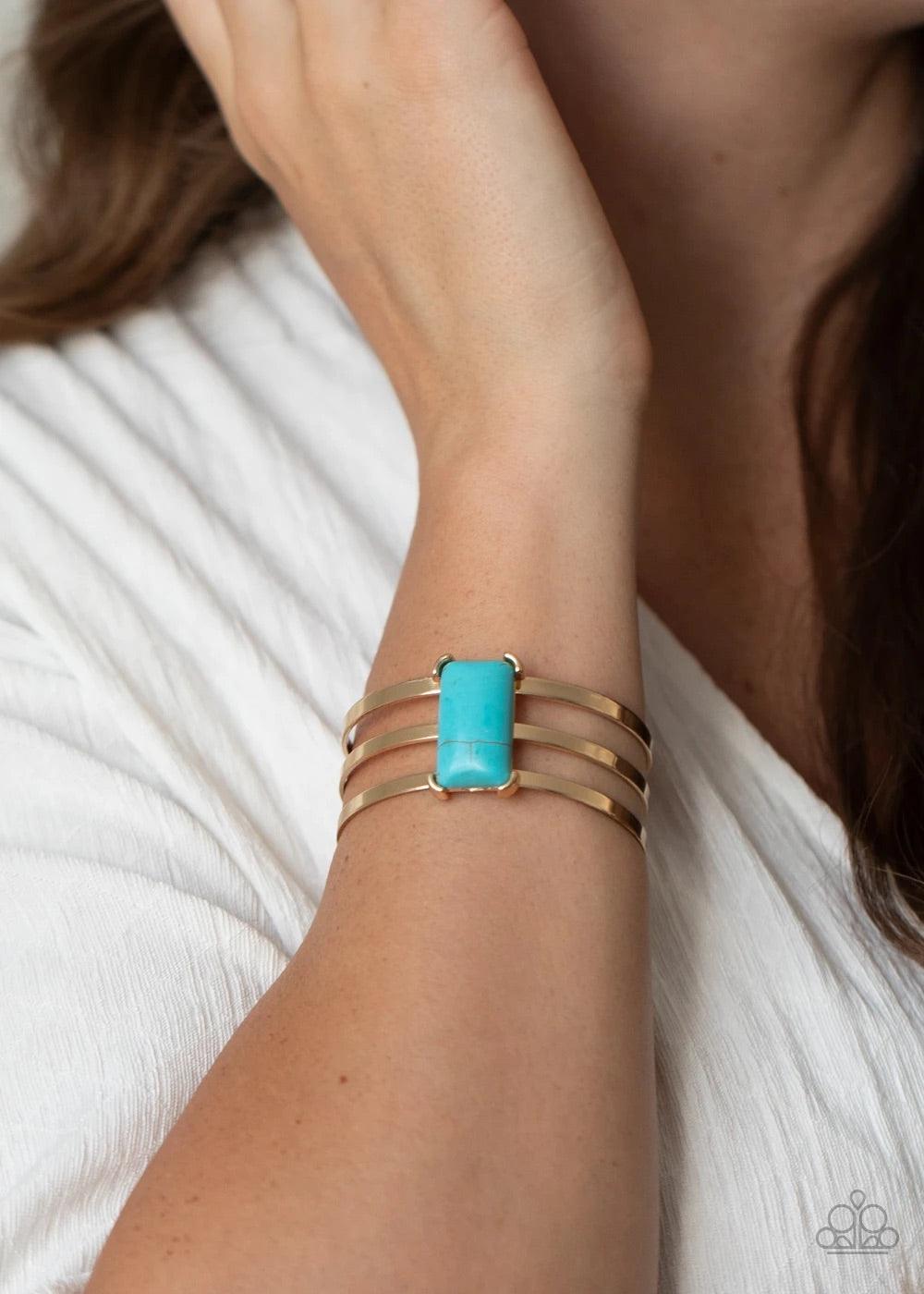 Paparazzi Accessories Rural Recreation - Blue Chiseled into a sleek rectangle, a refreshing turquoise stone is pressed into the center of a gold layered cuff for a seasonal flair. Sold as one individual bracelet. Jewelry