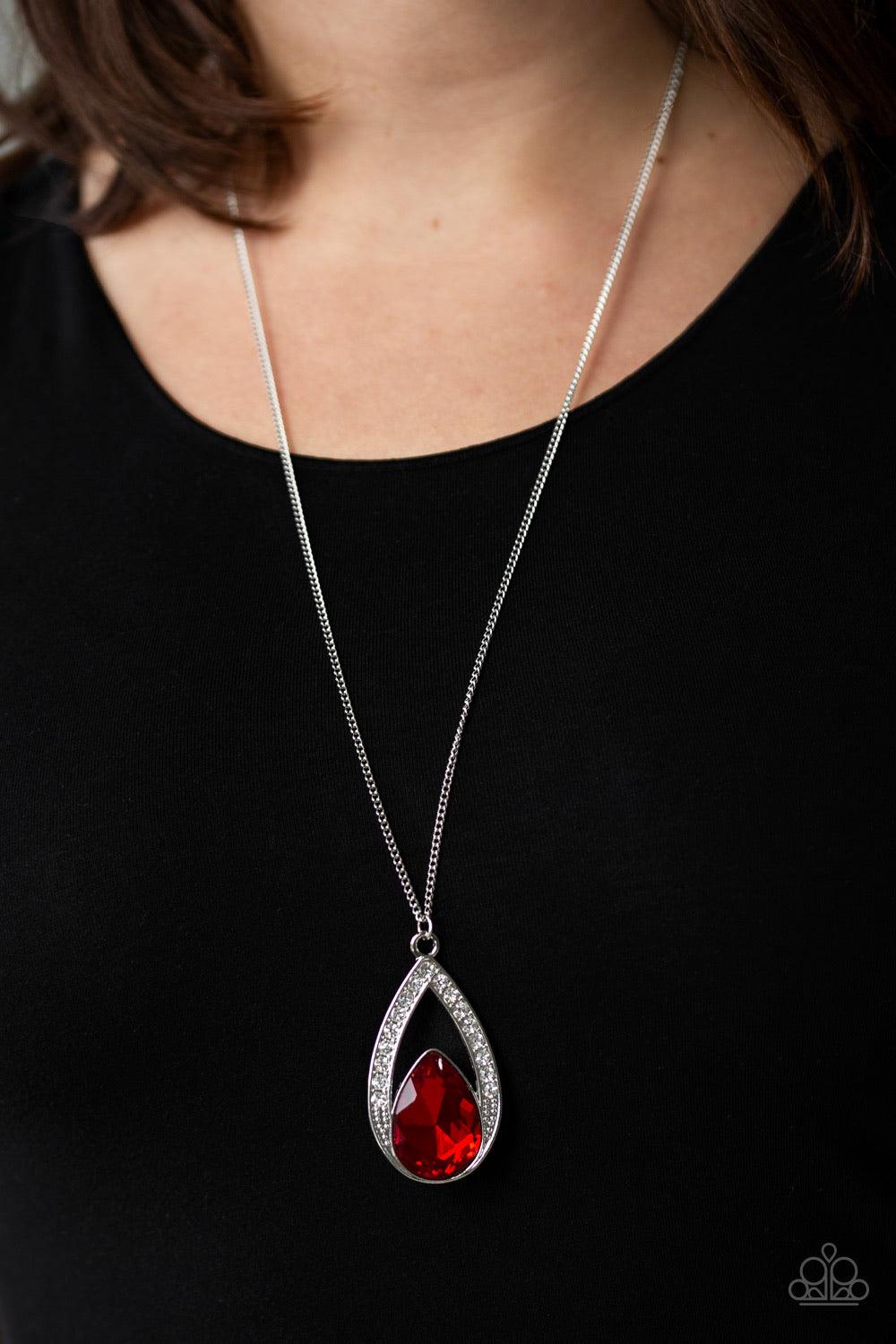 Paparazzi Accessories Notorious Noble - Red A fiery Samba teardrop gem is pressed into a silver frame radiating with glassy white rhinestones. The glamorous pendant swings from the bottom of a shimmery silver chain for a refined look. Features an adjustab