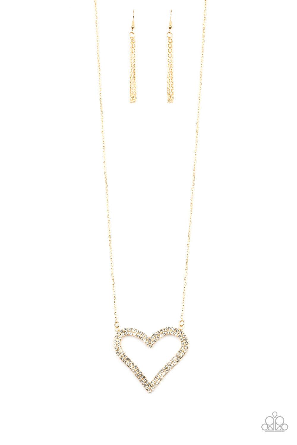 Paparazzi Accessories Pull Some HEART-strings - Gold Two rows of glittery white rhinestones stack into a sparkling heart pendant at the bottom of a lengthened gold chain for a heart-stopping look. Features an adjustable clasp closure. Jewelry