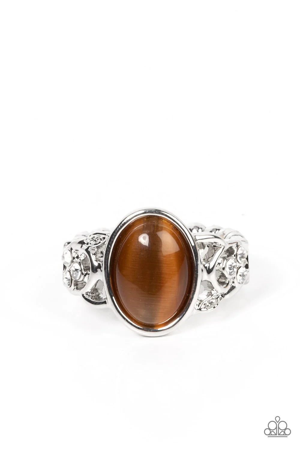 Paparazzi Accessories Crystals and Cat’s Eye - Brown An oval brown cat's eye stone adorns the center of a sleek silver fitting atop a band of braided silver bands timelessly dusted in dainty white rhinestones. Features a dainty stretchy band for a flexibl