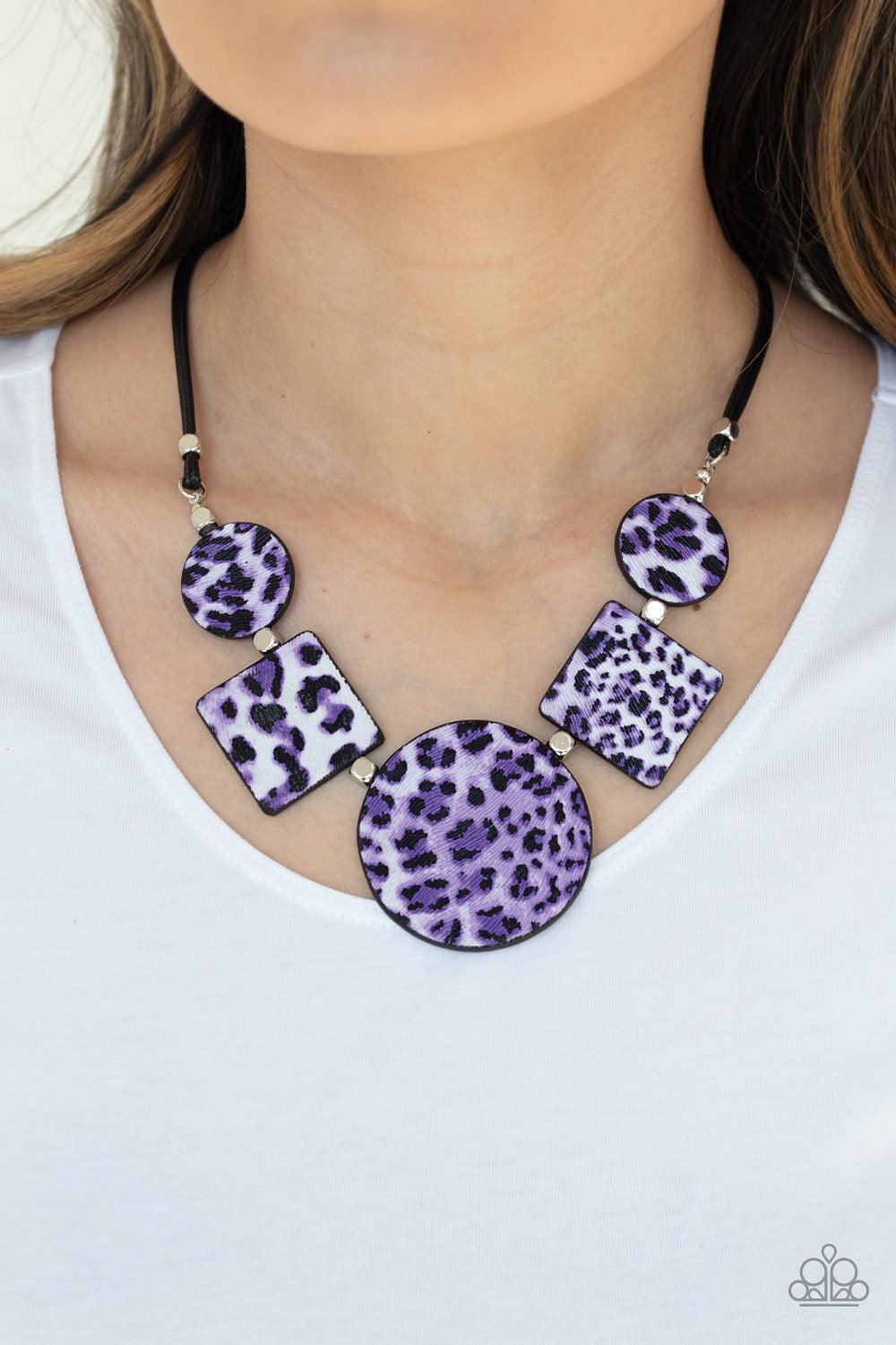 Paparazzi Accessories Here Kitty Kitty - Purple Featuring textured purple cheetah print, a wild collection of circle and square leather pieces are threaded along an invisible wire below the look for a fierce look. Features an adjustable clasp closure. Sol