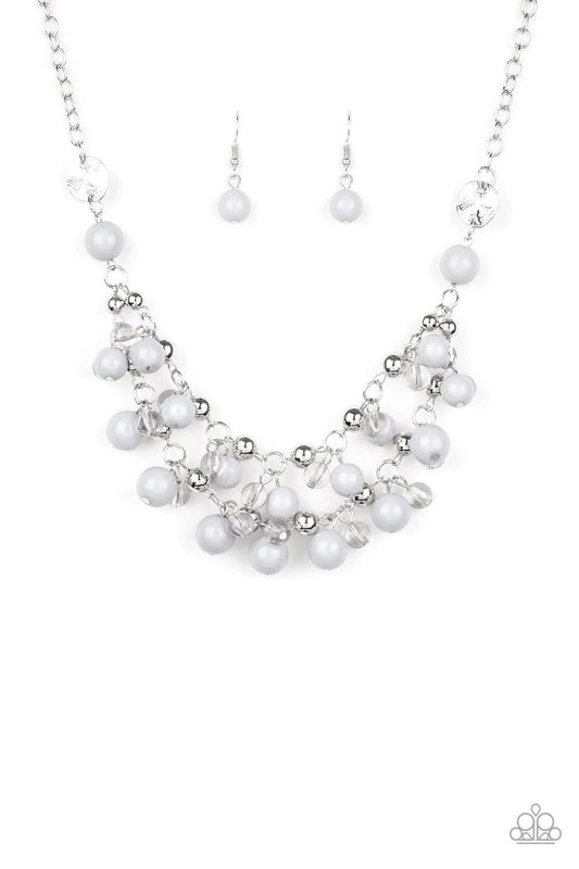 Paparazzi Accessories Seaside Soirée - Silver Hammered silver discs give way to layers of polished gray, glassy, and shiny silver beads. The colorful collection layers below the collar, creating a bubbly fringe. Features an adjustable clasp closure. Sold