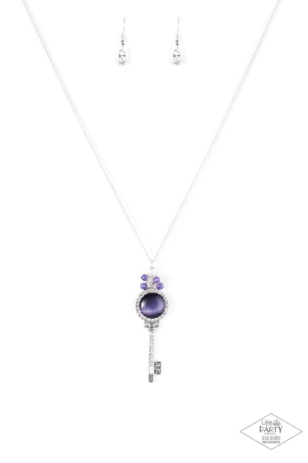 Paparazzi Accessories Unlock Every Door ~Purple A luminescent purple cat's eye stone is pressed into a silver key charm, creating a colorful pendant. Infused with iridescent purple cat's eye beading, the silver key is encrusted in glittery white rhineston