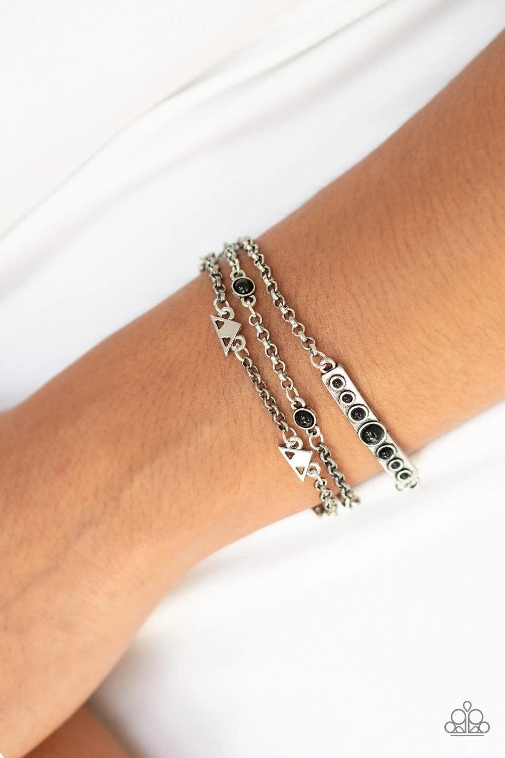 Paparazzi Accessories No Means NOMAD - Black A dramatic collection of oversized white pearls and textured copper rings interconnect across the chest, creating a bold display of refinement. Features an adjustable clasp closure. Jewelry