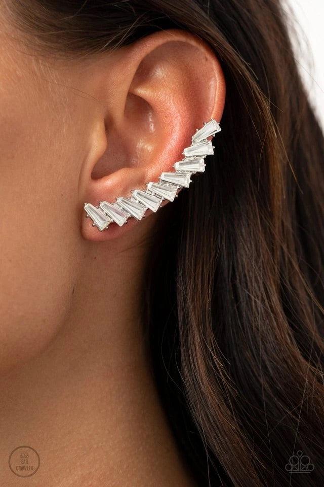 Paparazzi Accessories I Think Ice Can - White An icy stack of white rhinestone gems climb the ear, coalescing into a shockingly sparkly frame. Earring attaches to a standard post fitting. Features a dainty cuff attached to the top for a secure fit. Sold a