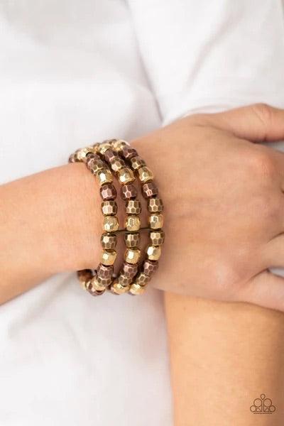 Paparazzi Accessories Magnetically Maven ~Multi Held together with dainty brass fittings, rows of faceted brass, copper, and gold beads are threaded along stretchy bands around the wrist, coalescing into bold layers. Sold as one individual bracelet. Jewel