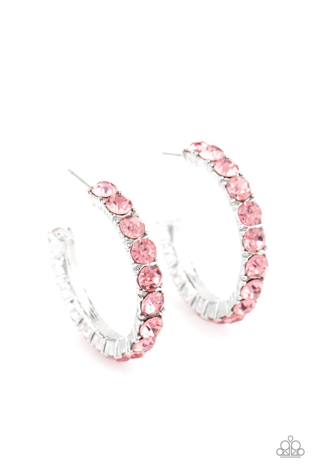 Paparazzi Accessories CLASSY is in Session - Pink An oversized collection of glittery pink rhinestones are encrusted along a textured silver hoop, creating a glamorous sparkle. Earring attaches to a standard post fitting. Hoop measures approximately 1 1/2