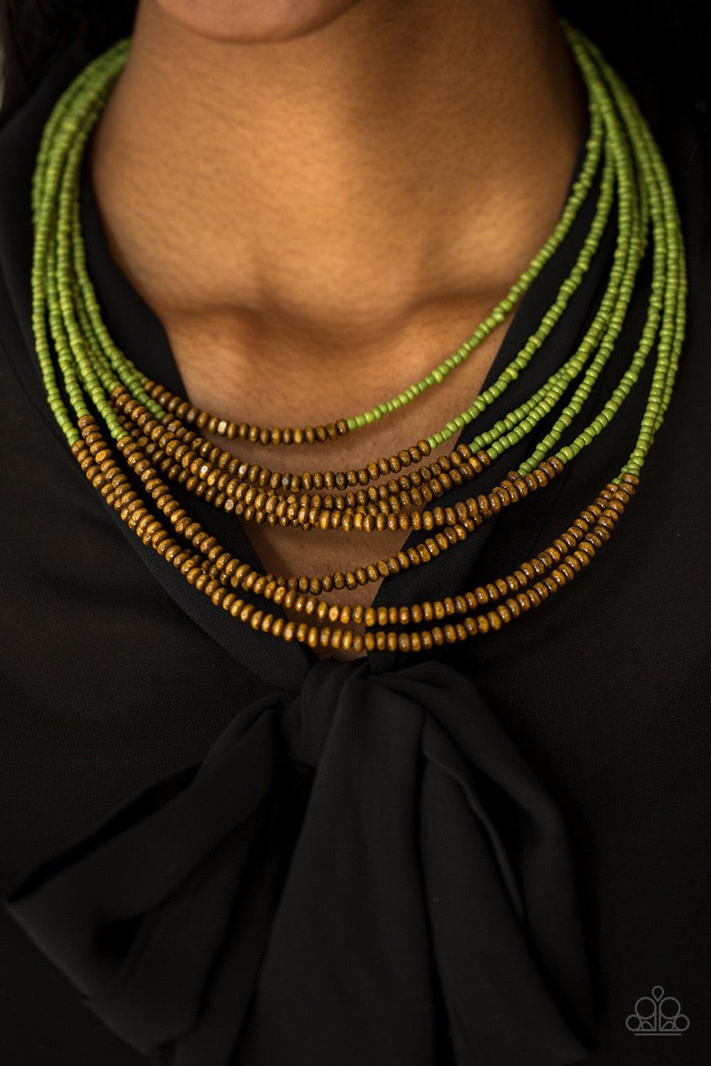 Paparazzi Accessories The Savannah Plains - Green Countless green seed beads fall into a tiered display. Dainty wooden beads adorn the center of the colorful strands, adding an earthy twist to the beautiful design. Features an adjustable clasp closure. Je